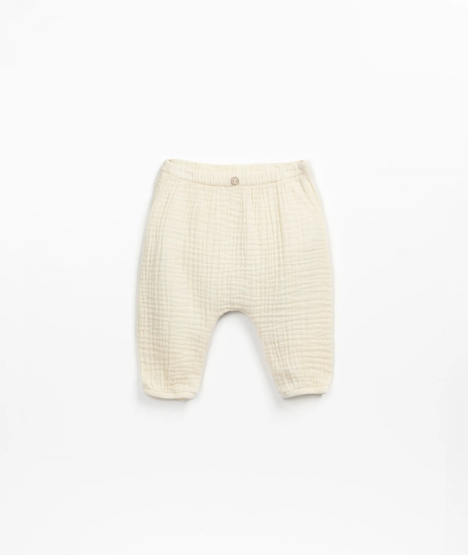 Pantalón de tela con botón de coco de adorno | Textile Art